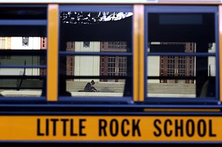 A school bus passes as students head into the building for the first day of school at Little Rock Central High School on Monday, Aug. 24, 2020. 
(Arkansas Democrat-Gazette/Thomas Metthe)